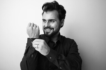 Black and white photo of happy bearded man. Handsome and confident.