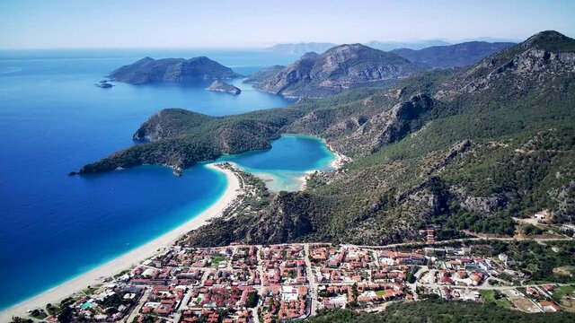 Amazing beautiful panoramic view from drone of natural park of Oludeniz and Fethiye blue lagoon and tranquil aquamarine dead sea.
