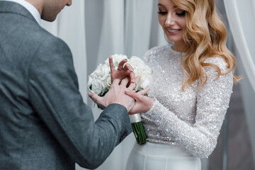 Brides exchange wedding rings at wedding ceremony