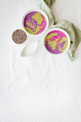 Acai smoothies bowles with chia seeds and superfoods, top view