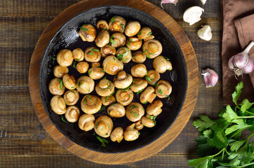 Fried mushrooms in cast iron pan