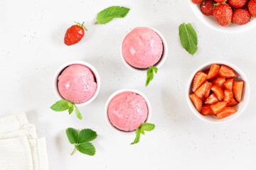 Strawberry ice cream scoop in bowl