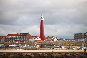 Skyline of Scheveningen with red lighthouse along the coast