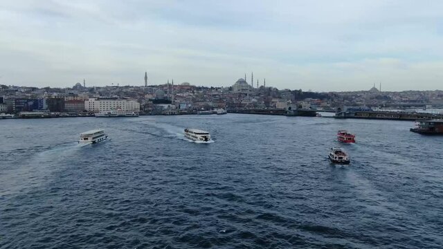 Aerial view of Istanbul Golden horn. Seagulls flying behind the ferry crossing the Bosphorus Strait in Istanbul, Turkey