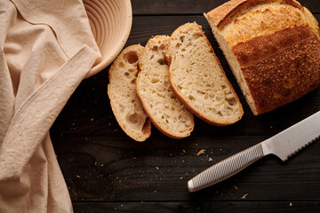 Homemade tartine bread on dark wooden table