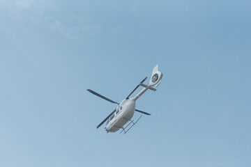 Helicopter for emergency evacuation of patients flying with blue sky background