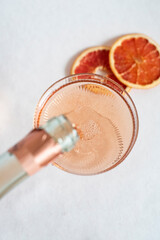 Rose champagne pouring into the vintage glass