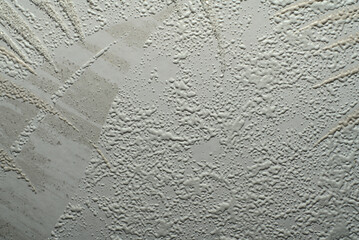 The texture is white with bumps and an unusual pattern. Dimmed lights