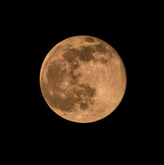 A close up image of the 2nd full moon of the year, also known a Snow Moon, rising over Yorkshire, England