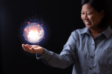 Business woman hand holding earth planet  technology creative connection internet networking commucation, female smile looking light orange network graphic inspiration design abstract background.