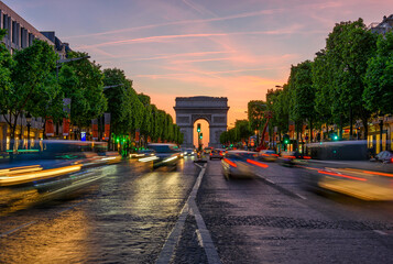 Champs-Elysees and Arc de Triomphe at sunset in Paris, France. Architecture and landmarks of Paris....