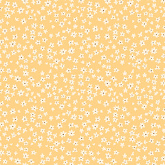 Vintage floral background. Floral pattern with small white flowers on a pale yellow background. Seamless pattern for design and fashion prints. Ditsy style. Stock vector illustration. © ann_and_pen