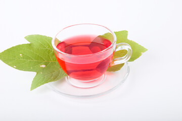 Roselle juice in a clear glass isolated on white background