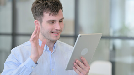 Video Call on Tablet by Young Man 
