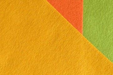 Orange, green and yellow felt fabric texture for background.