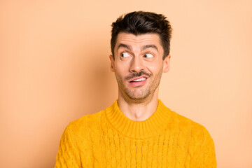 Photo of crazy unhappy shocked man look empty space dislike news face isolated on pastel beige color background