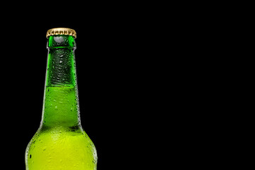 Green beer bottle isolated on black background. Place for text. Space for a logo or text.