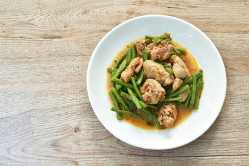 stir fried slice yarg long bean with chicken curry sauce on plate