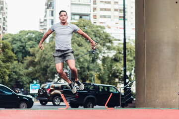 young latin man, exercising outdoors