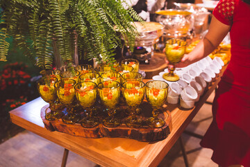 woman picking up starter food at buffet