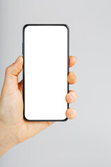 Smartphone with a clean white screen in your hand close-up.