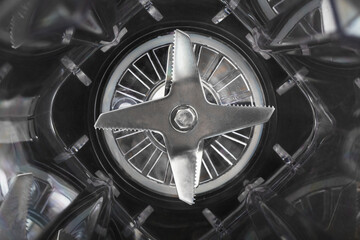 Fototapeta premium Empty Blender Bowl Top view with blades on black background.