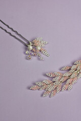 Pink and white hair accessories on violet background