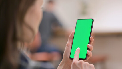 Female Holding Smartphone with Green Chroma Key Screen