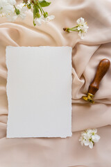 Mockup invitation, blank paper greeting card, floral background, flat lay