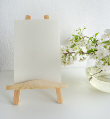 Mockup invitation, blank paper greeting card, floral background, flat lay