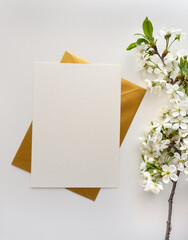 Mockup invitation, blank paper greeting card, floral background, flat lay