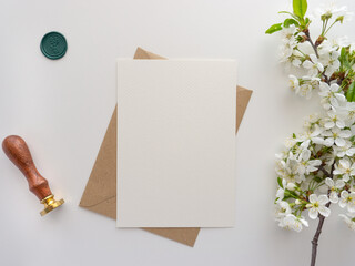 Mockup invitation, blank paper greeting card, floral background, flat lay