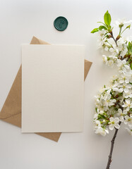 Mockup invitation, blank paper greeting card, floral background, flat lay