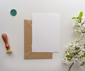 Mockup invitation, blank paper greeting card, floral background, flat lay