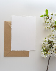 Mockup invitation, blank paper greeting card, floral background, flat lay