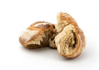 Torn fresh bread on a white background