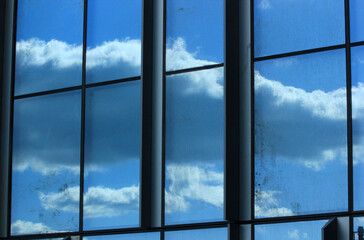 reflection of clouds in the window