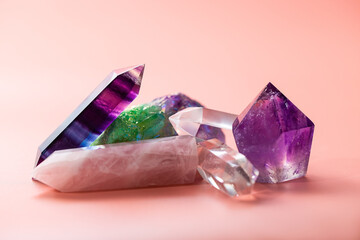 Faceted amethyst, rose quartz, fluorite, rock crystal, quartz cluster taken close up. Various crystals for healing and magical practices