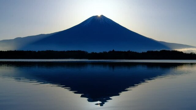 Mt. Fuji and Sun of sunrise from Lake Tanuki Fujinomiya City Japan 04/23/2021