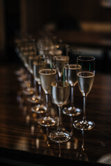 glasses with champagne in a dark room