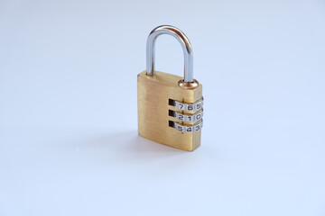 Close up, golden padlock with password,pass code on white background. There is no need key to use this padlock