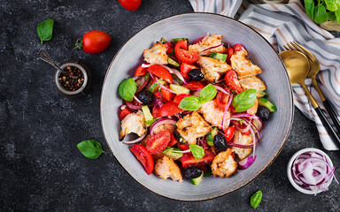 Tuscan Panzanella, traditional Italian salad with tomatoes and bread. Vegetarian panzanella salad. Mediterranean healthy food. Top view, copy space