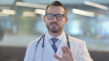 Portrait of Online Video Call by Young Male Doctor 