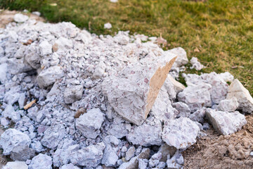A mountain of construction waste made of concrete stones of different sizes against the background...