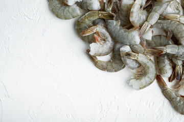 Fresh tiger shrimps, prawns, on white stone  surface, with copy space for text
