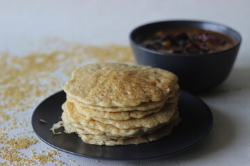 Rice pancakes made with foxtail millets flour. An experimental version of a popular Kerala dish called kallapam served with Chana masala, a dish made with chickpea.