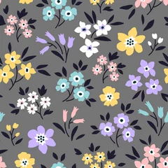 Fotobehang Elegant pattern in small flowers are scattered on the surface. Liberty style. Floral seamless background. Ditsy print. Vector texture. A bouquet of spring flowers for fashion prints. Stock vector. © ann_and_pen