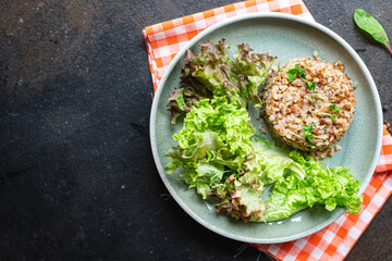 buckwheat and salad fresh green mix salad lettuce trend diet meal snack copy space food background rustic. top view keto or paleo diet vegan or vegetarian food