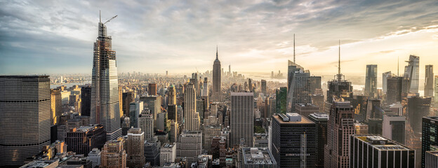 Manhattan skyline panorama at sunset with view of Empire State Building, New York City, USA
