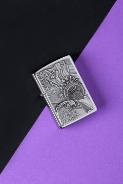 Jeddah Saudi Arabia March 31 2021 Zippo lighter on a Purple coloured background retro lighter.Zippo lighters have gained popularity as windproof lighters.